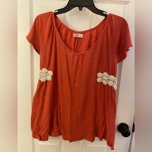 Short sleeve orange maternity top with side decor